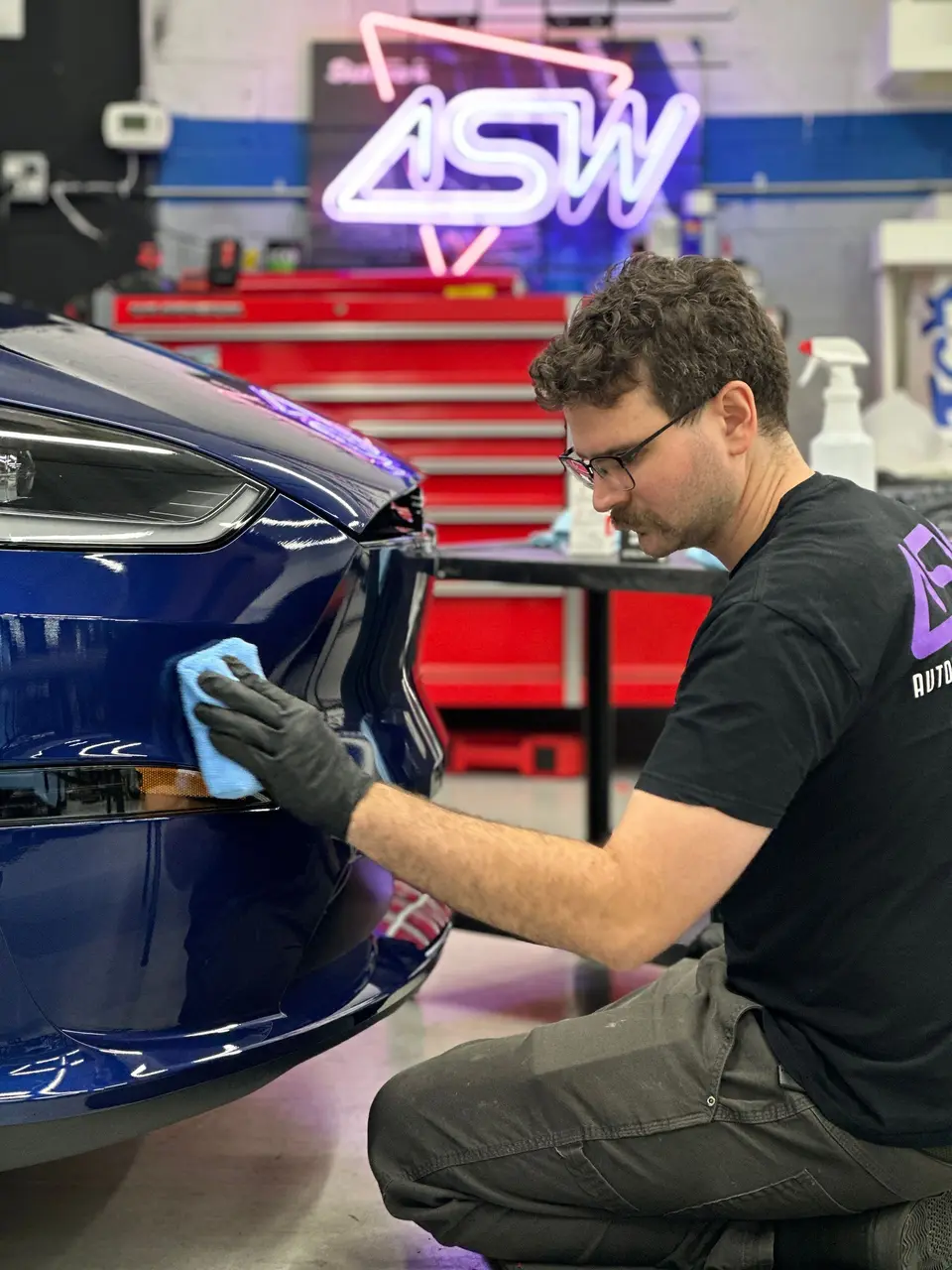 Coating a Tesla Model X under the ASW sign