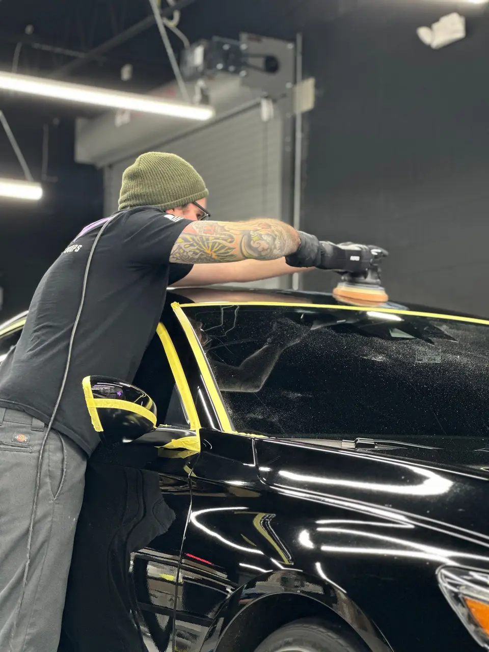 Polishing a black Honda Accord