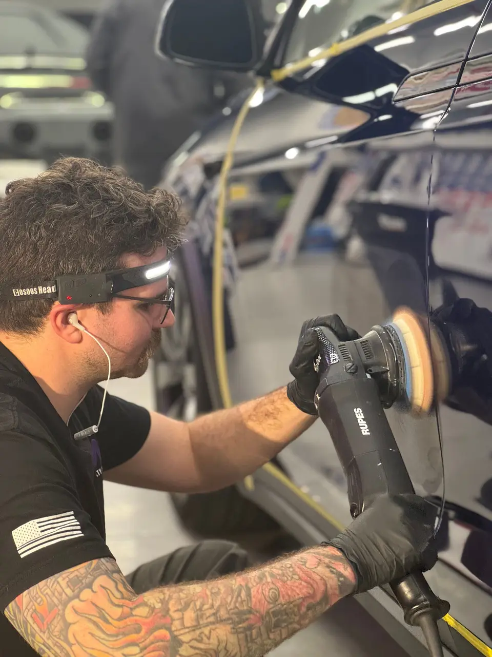 Machine polishing a Tesla Model X