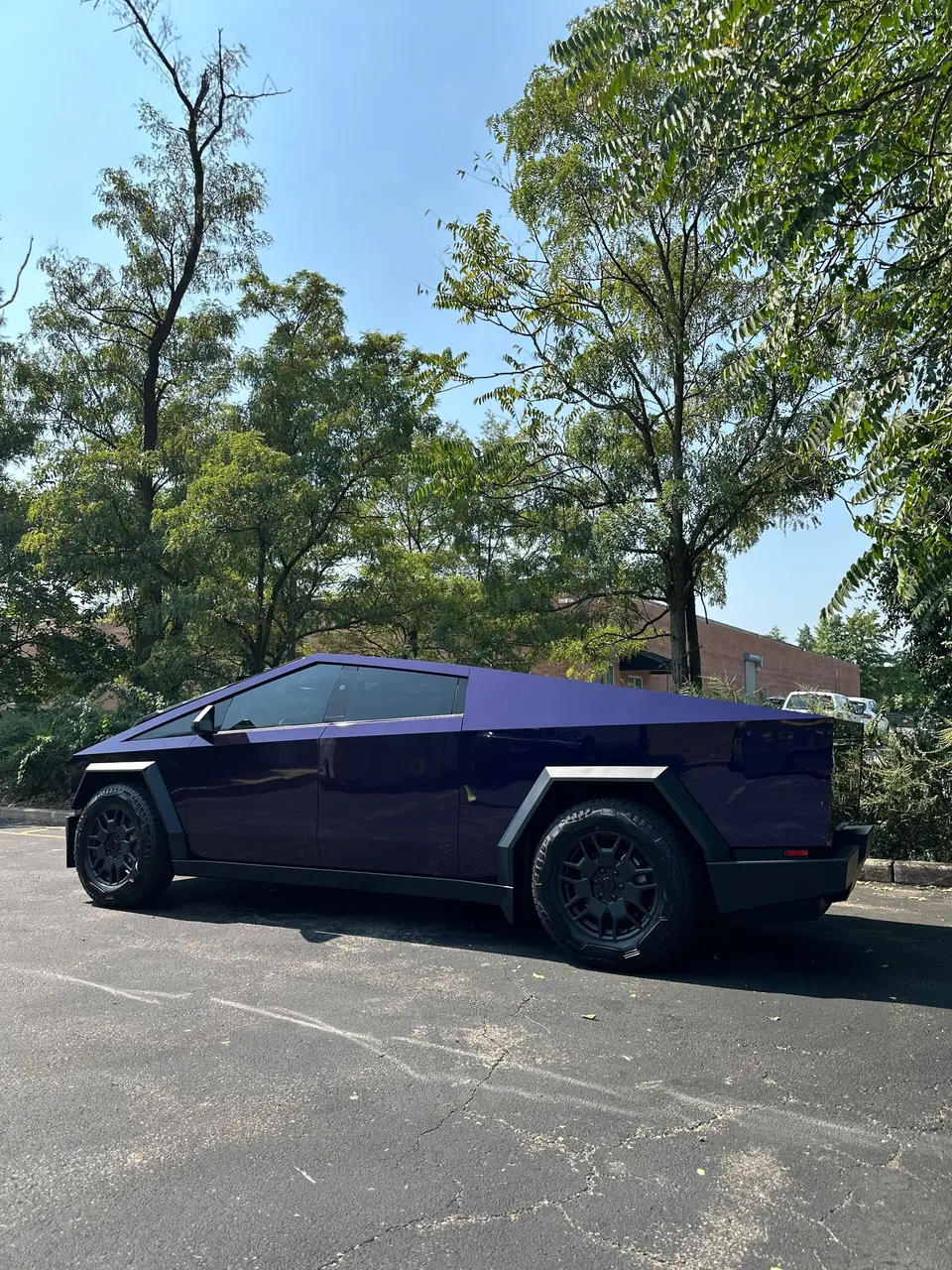 Cybertruck in purple color-change PPF, front three-quarter