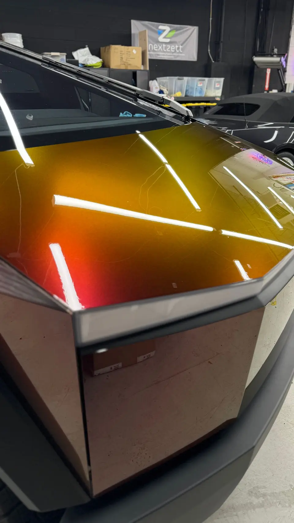 Red color PPF going onto a Cybertruck