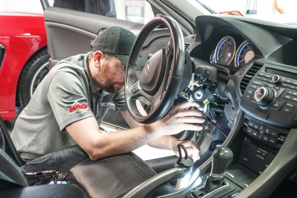 Steam cleaning a green Porsche 911