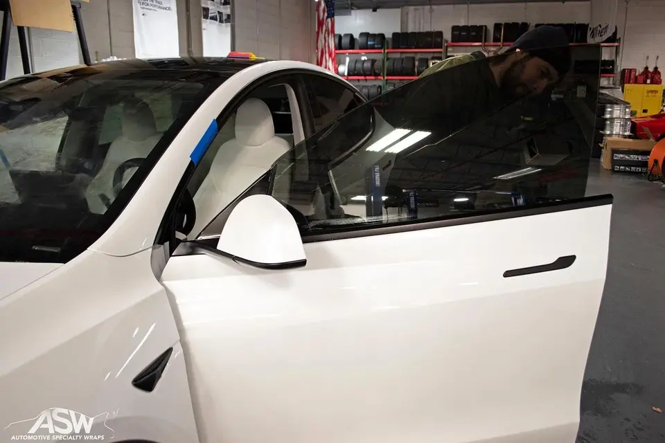 Window film on a white Tesla